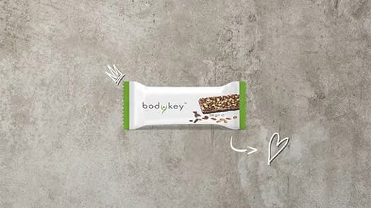 BARRE SUBSTITUT DE REPAS GOÛT CHOCOLAT NOIR - bodykey by NUTRILITE™ video